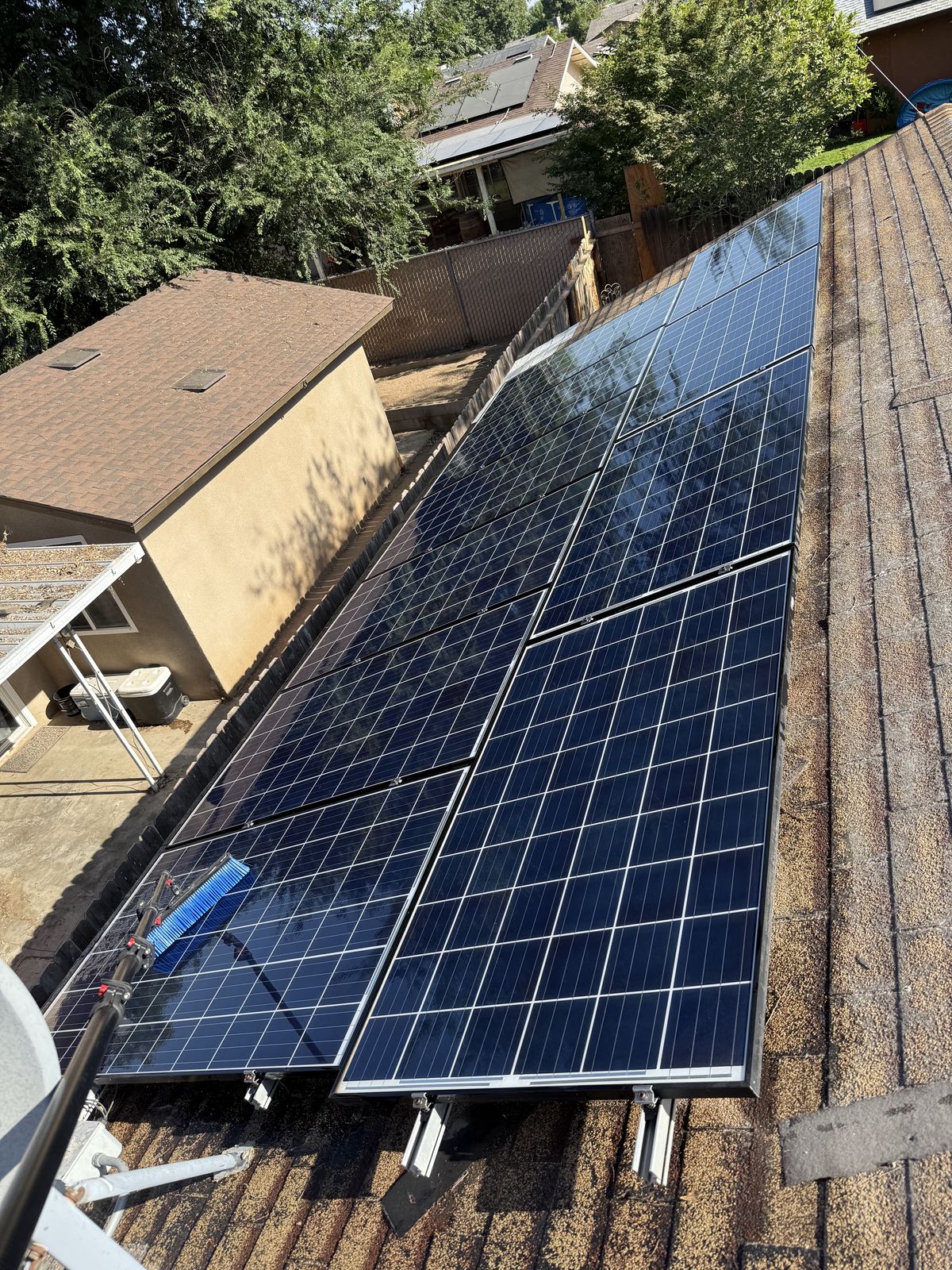 The same solar array after cleaning — glossy, streak-free and residue-free